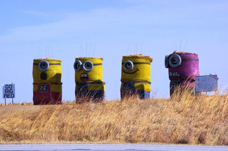 Four Minions standing together
