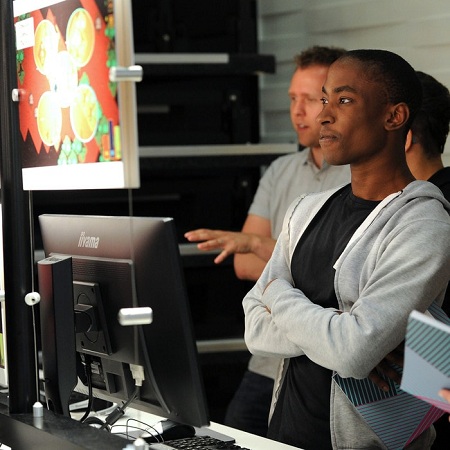 students-at-Digital-Design-Show-2017-looking-at-double-height-computer-screens.jpg